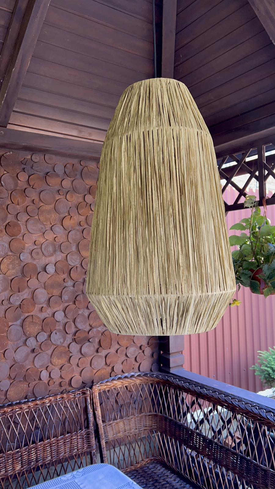 Exotic pendant light woven from raffia in morrocan style