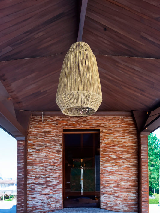 Exotic pendant light woven from raffia in morrocan style